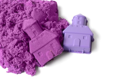 Photo of Castle made of purple kinetic sand and plastic mold on white background, top view
