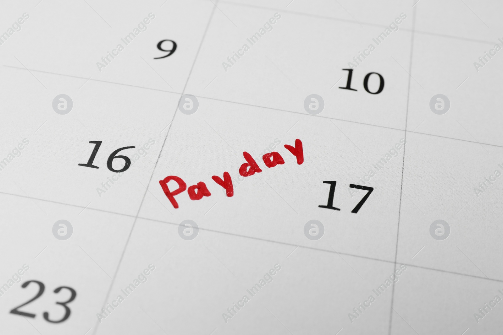 Photo of Calendar page with marked payday date as background, closeup