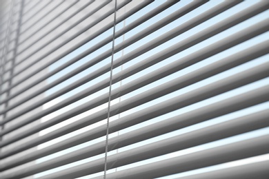 Photo of Closeup view of window with horizontal blinds, low angle view