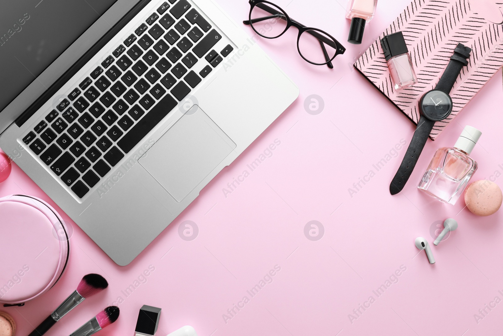 Photo of Flat lay composition with laptop on pink background. Beauty blogger's workplace