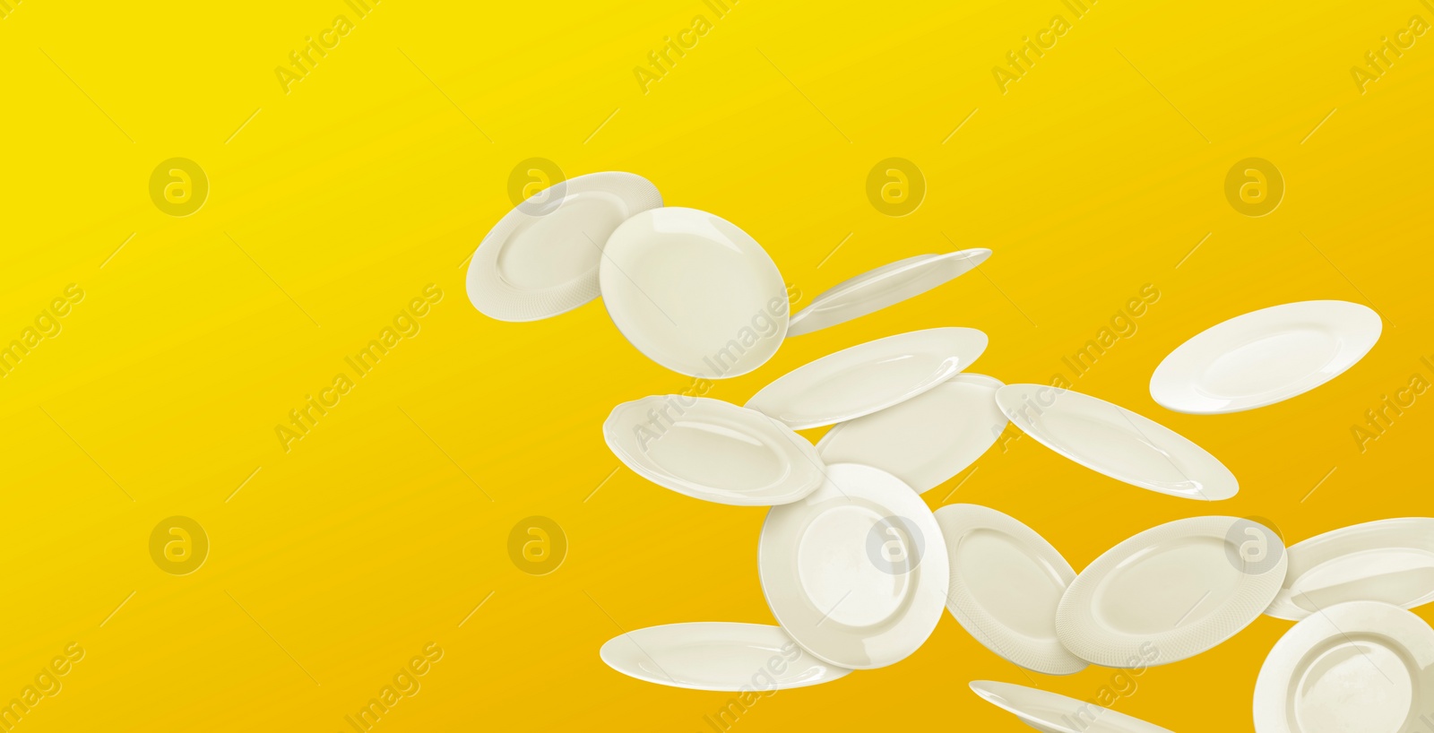 Image of Many white plates falling on yellow background, banner design