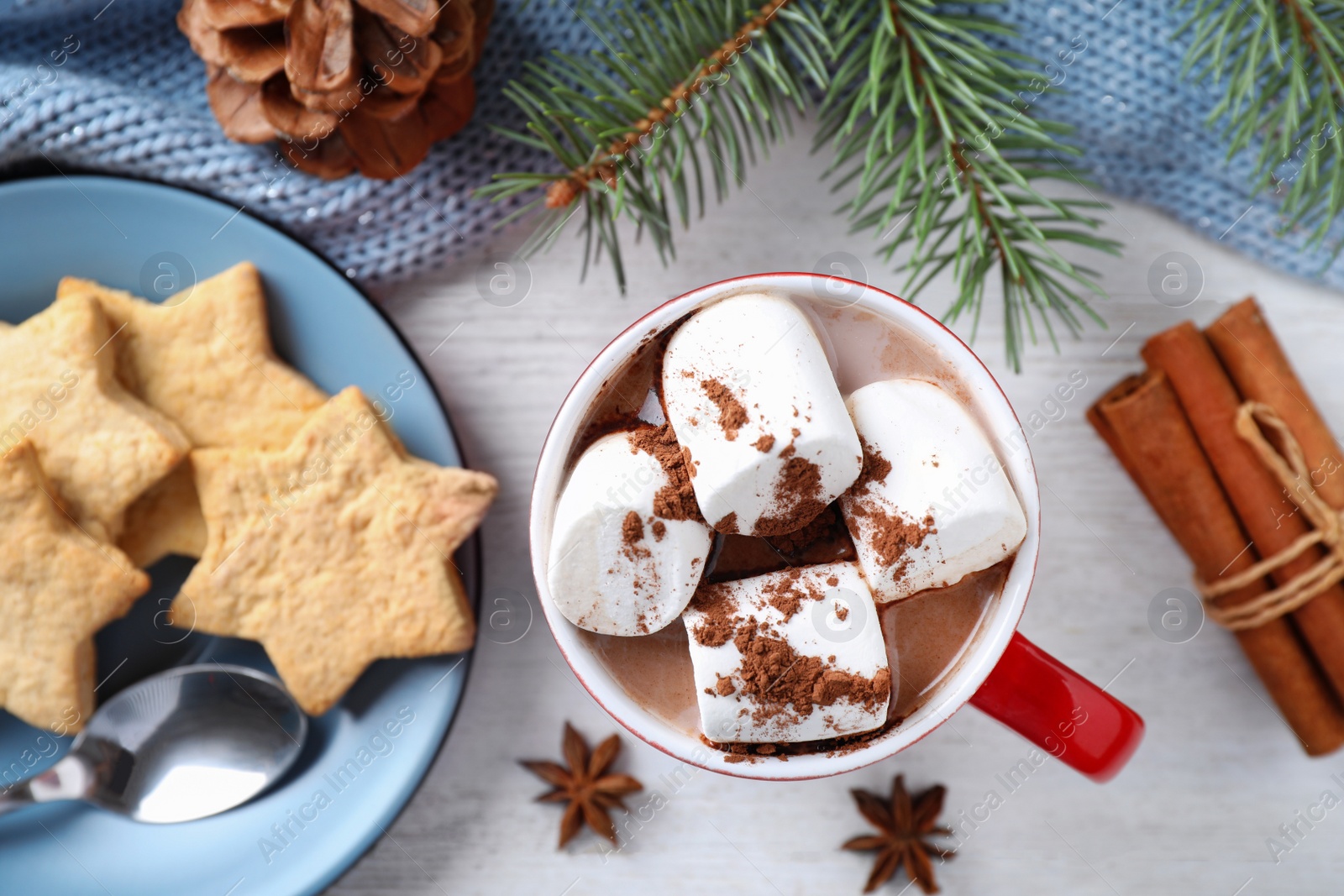 Photo of Flat lay composition of tasty cocoa with marshmallows on white wooden table