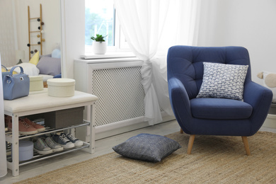Photo of Modern teenager's room interior with comfortable armchair