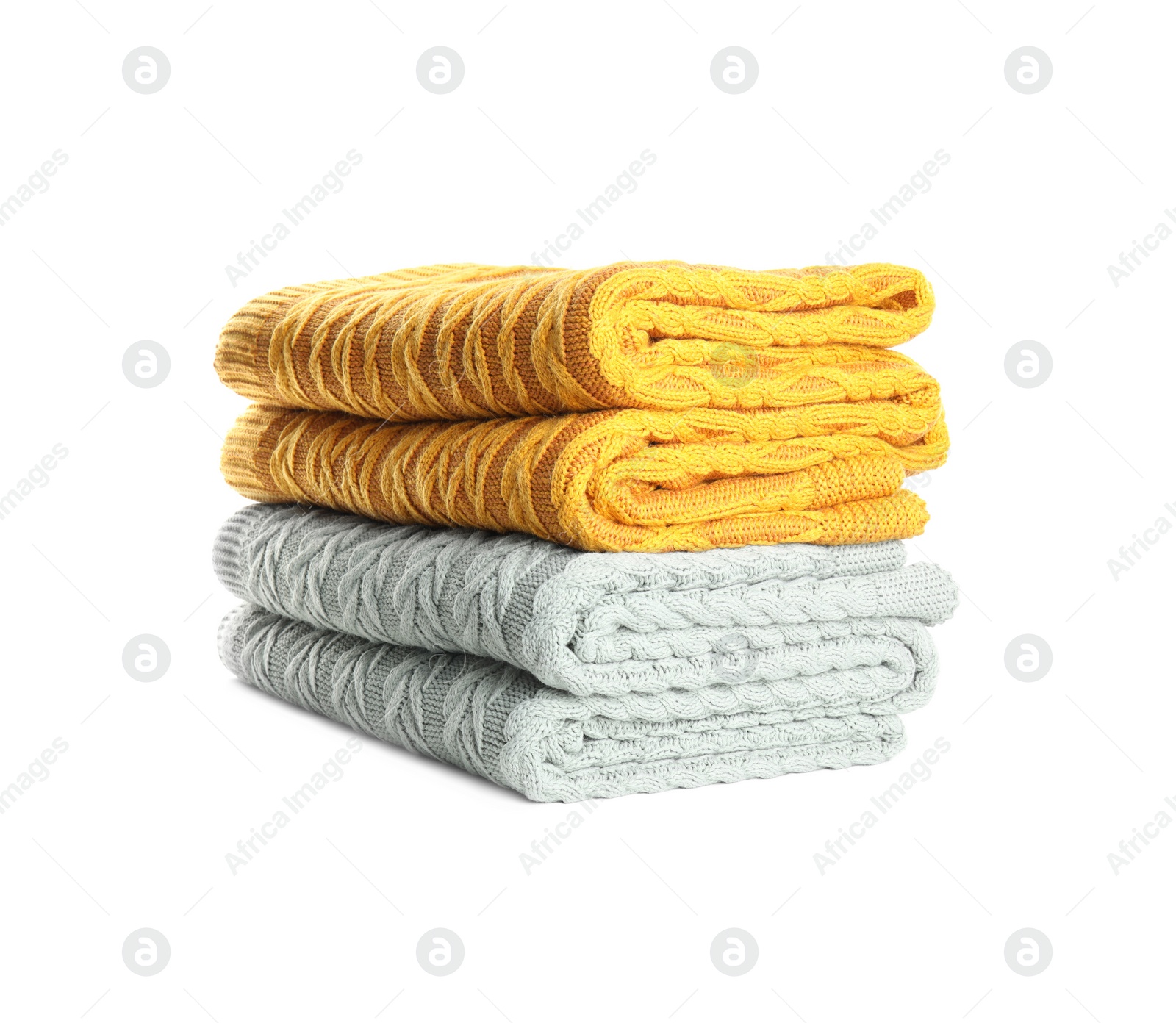 Photo of Different stylish knitted plaids on white background