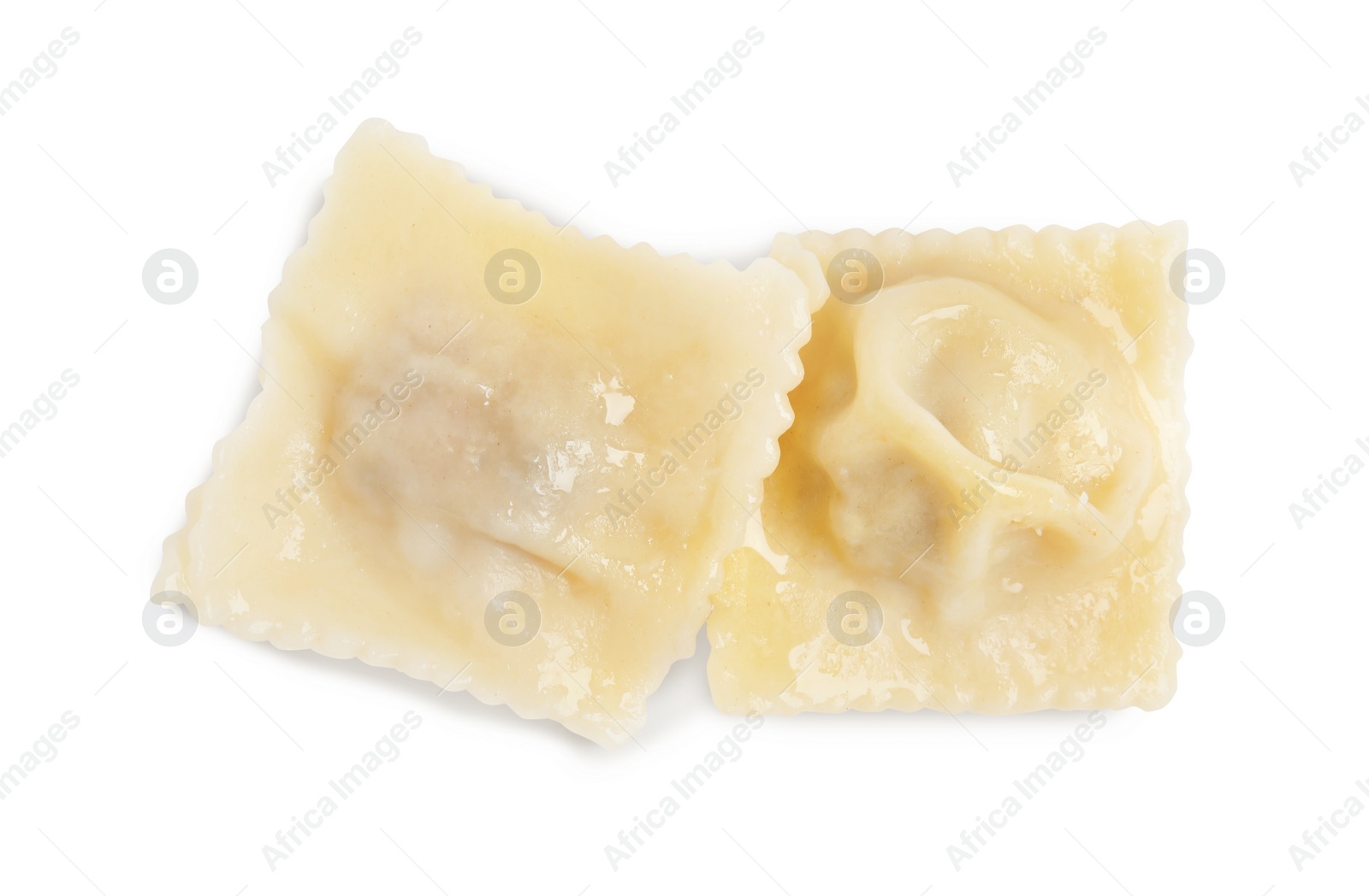 Photo of Boiled ravioli with tasty filling on white background, top view