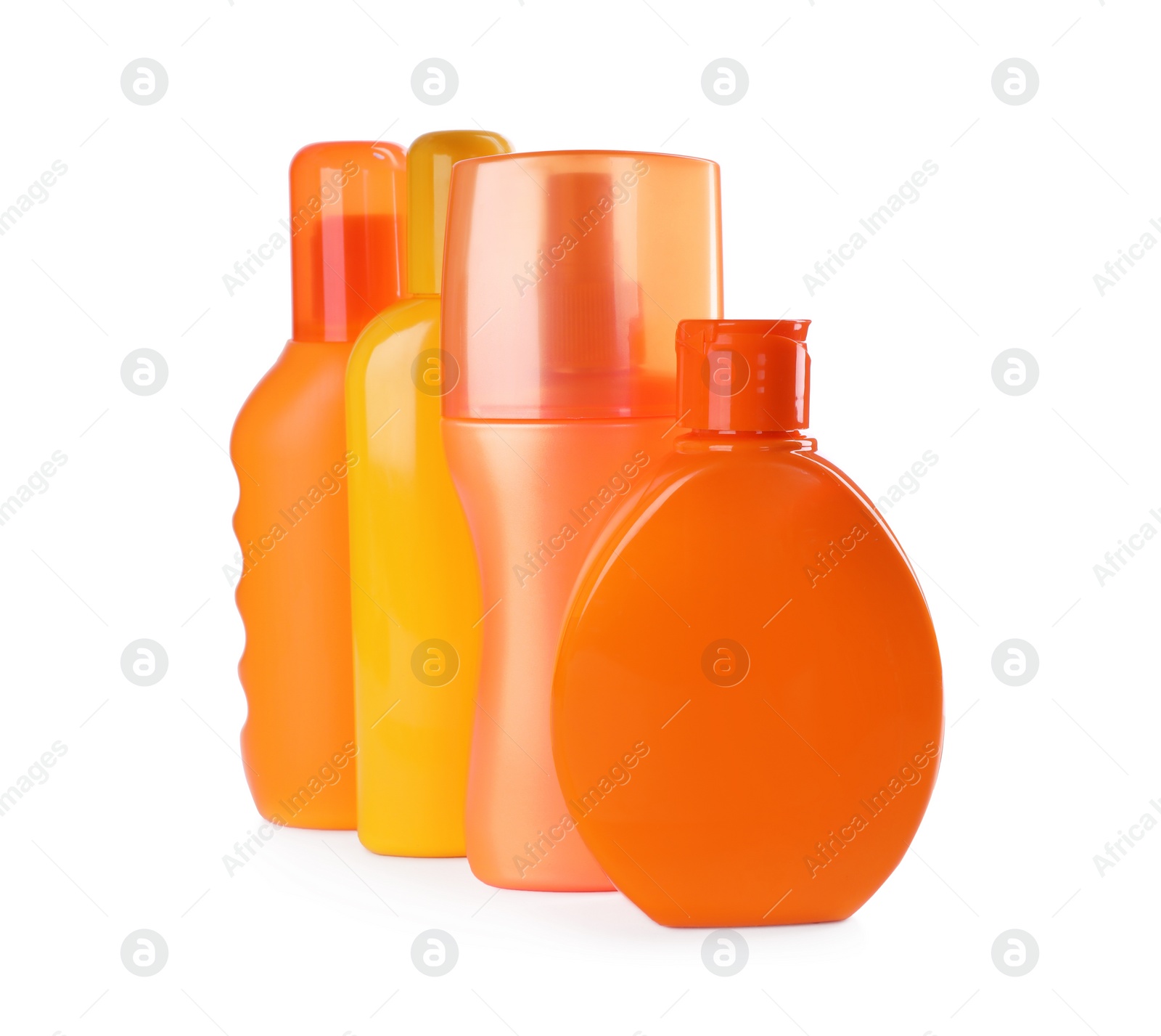 Photo of Bottles with sun protection products isolated on white