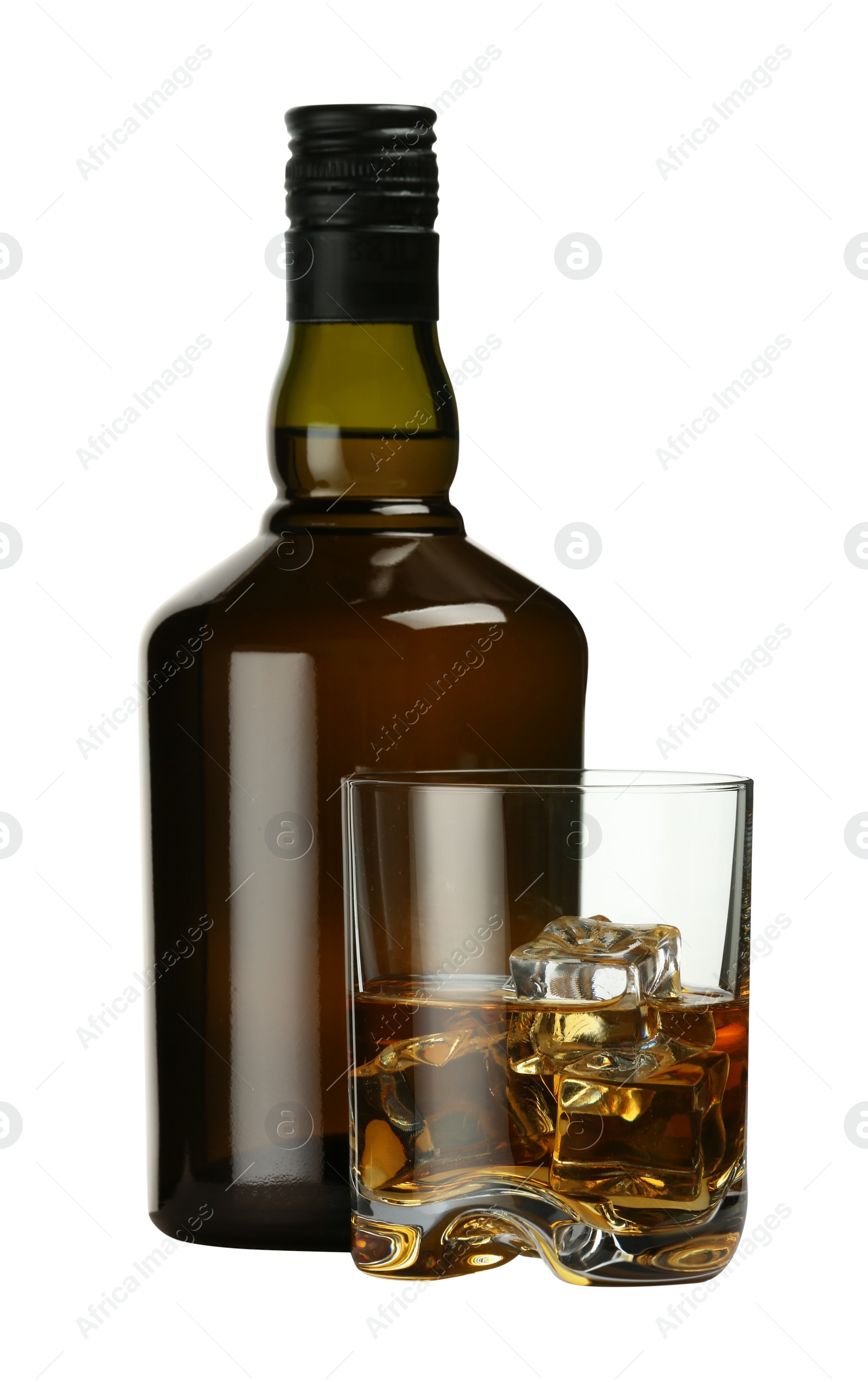 Photo of Whiskey in glass and bottle isolated on white