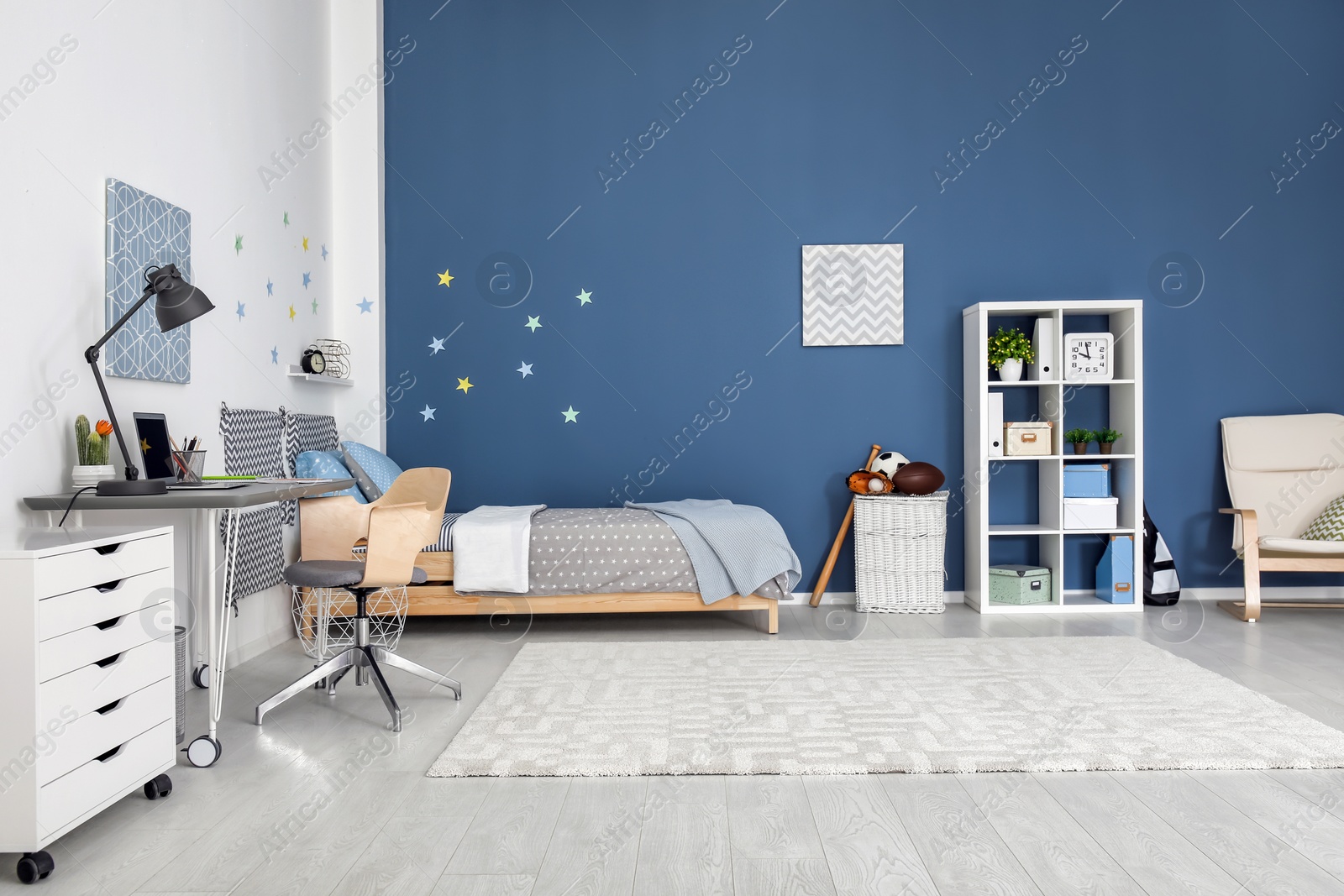 Photo of Modern child room interior with comfortable bed and desk