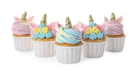 Many cute sweet unicorn cupcakes on white background