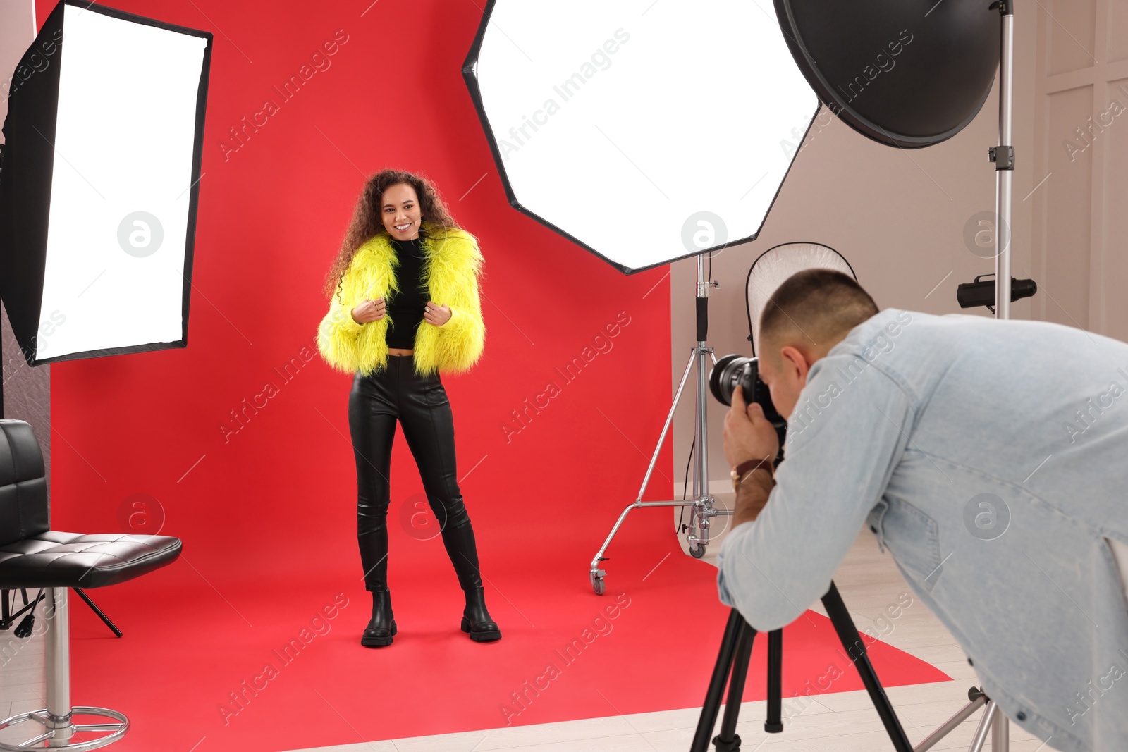 Photo of Beautiful African American model posing for professional photographer in studio