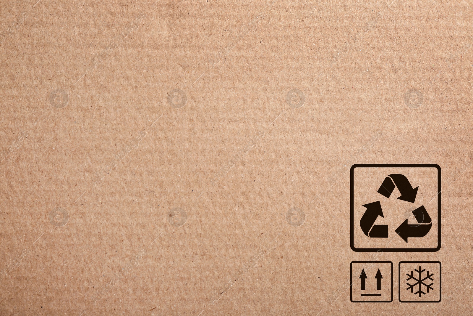 Image of Cardboard box with packaging symbols as background, closeup