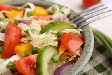 Tasty salad with Chinese cabbage in bowl on table, closeup