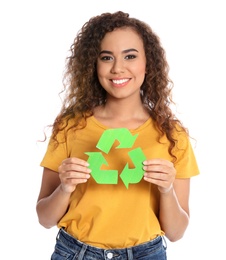 Young African-American woman with recycling symbol on white background