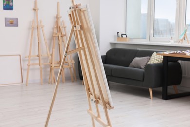 Studio with easels and sofa. Artist`s workspace