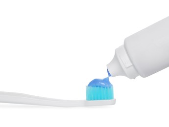 Photo of Applying paste on toothbrush against white background