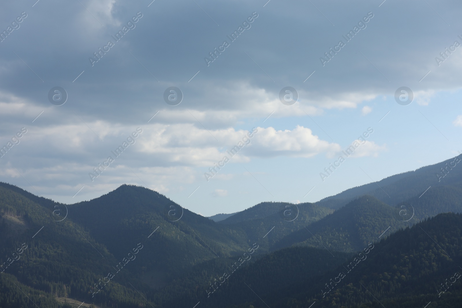 Photo of Beautiful view of majestic mountains under cloudy sky