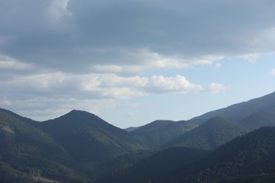 Beautiful view of majestic mountains under cloudy sky