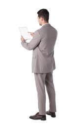 Man using tablet with blank screen on white background