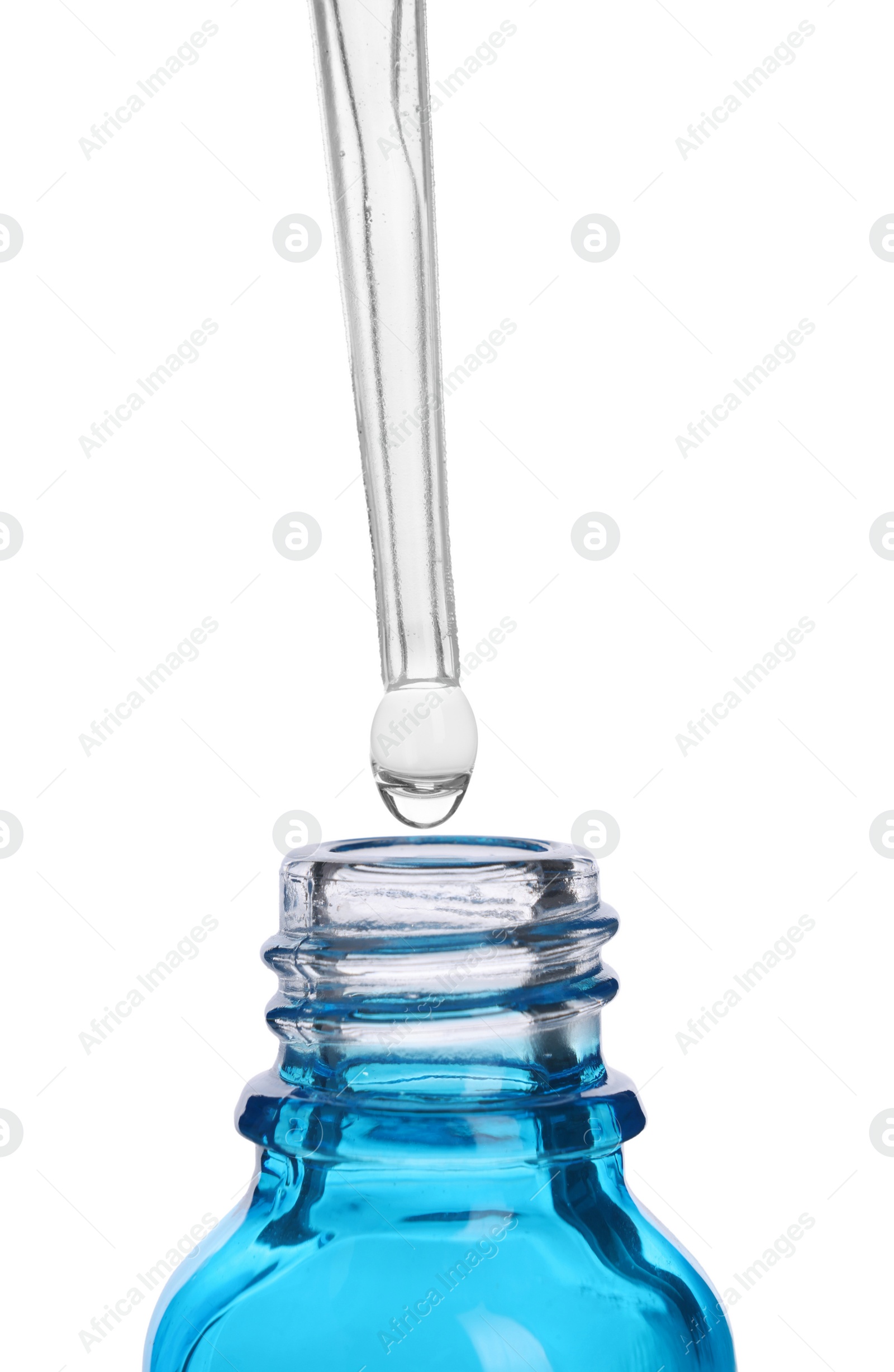 Photo of Dripping liquid from pipette into bottle isolated on white, closeup