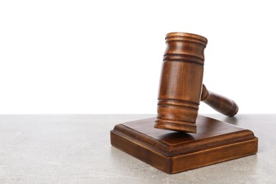 Photo of Wooden gavel on light table against white background. Space for text