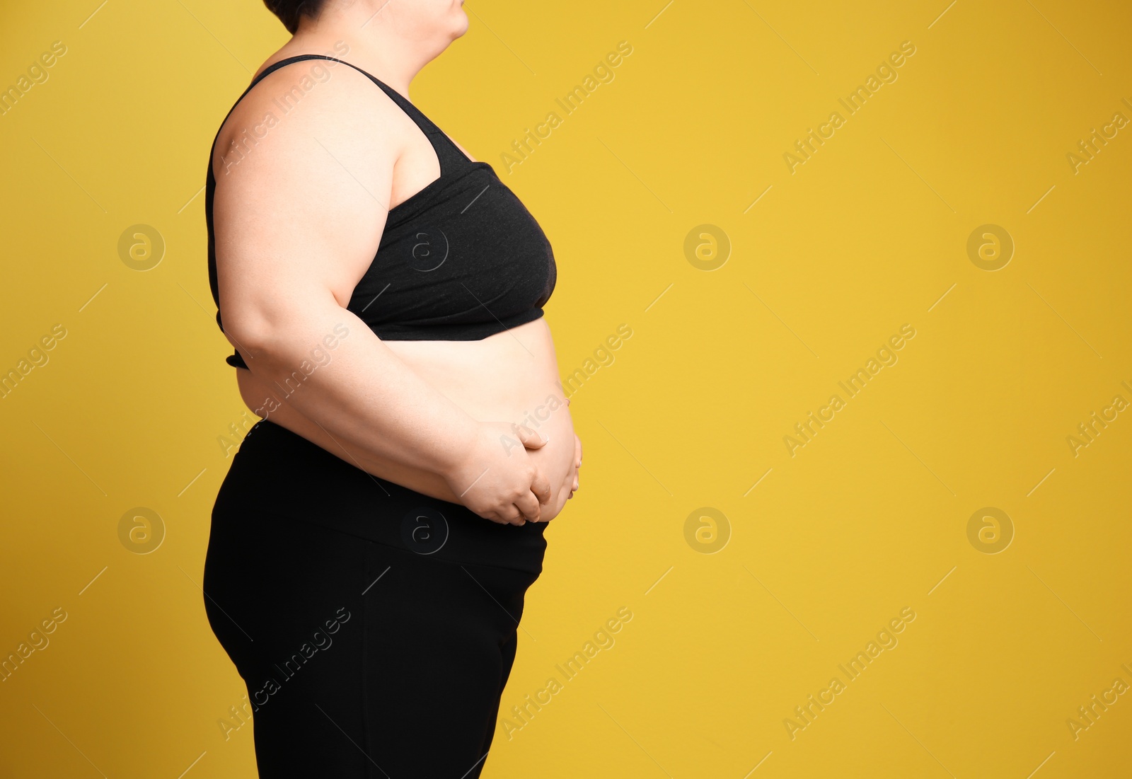 Photo of Overweight woman on color background