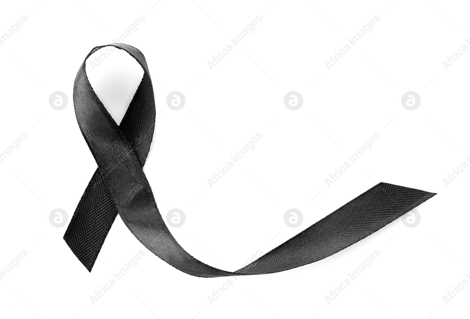 Photo of Black ribbon on white background, top view. Funeral symbol