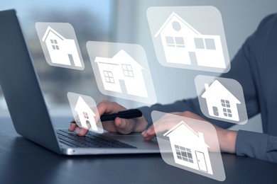 House search. Man choosing home via laptop at table, closeup. Illustrations of different buildings as real estate variations