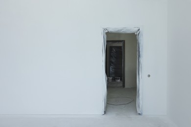Entrance in room with fresh painted walls