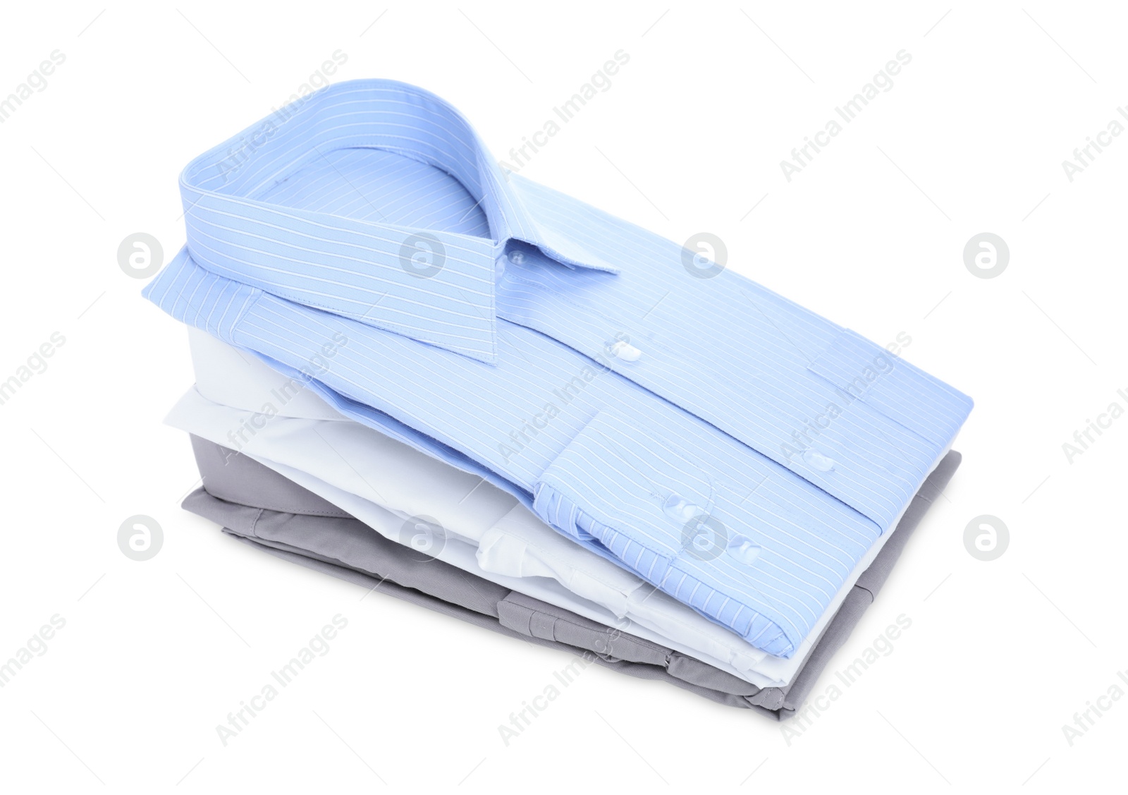 Photo of Stack of stylish shirts isolated on white. Dry-cleaning service