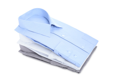 Stack of stylish shirts isolated on white. Dry-cleaning service