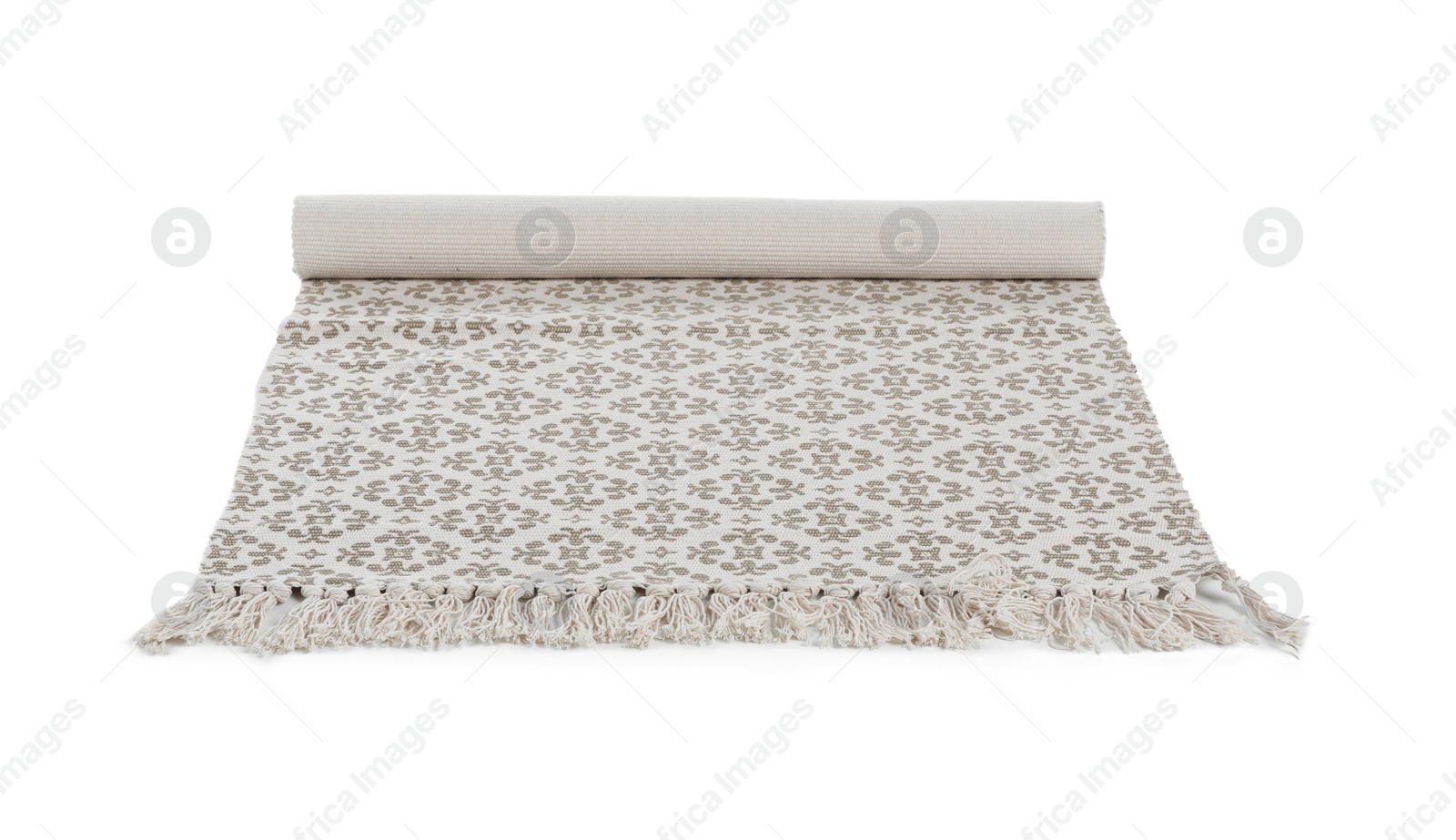 Photo of Rolled carpet with ornament on white background. Interior element