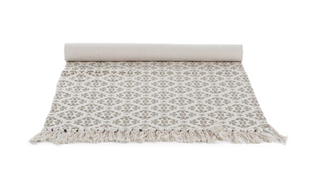 Rolled carpet with ornament on white background. Interior element