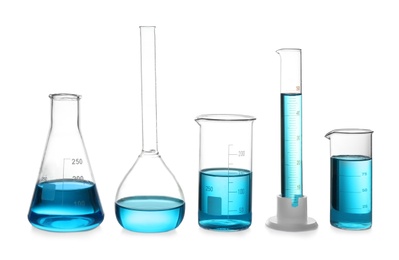 Photo of Glassware with blue liquid isolated on white. Laboratory analysis