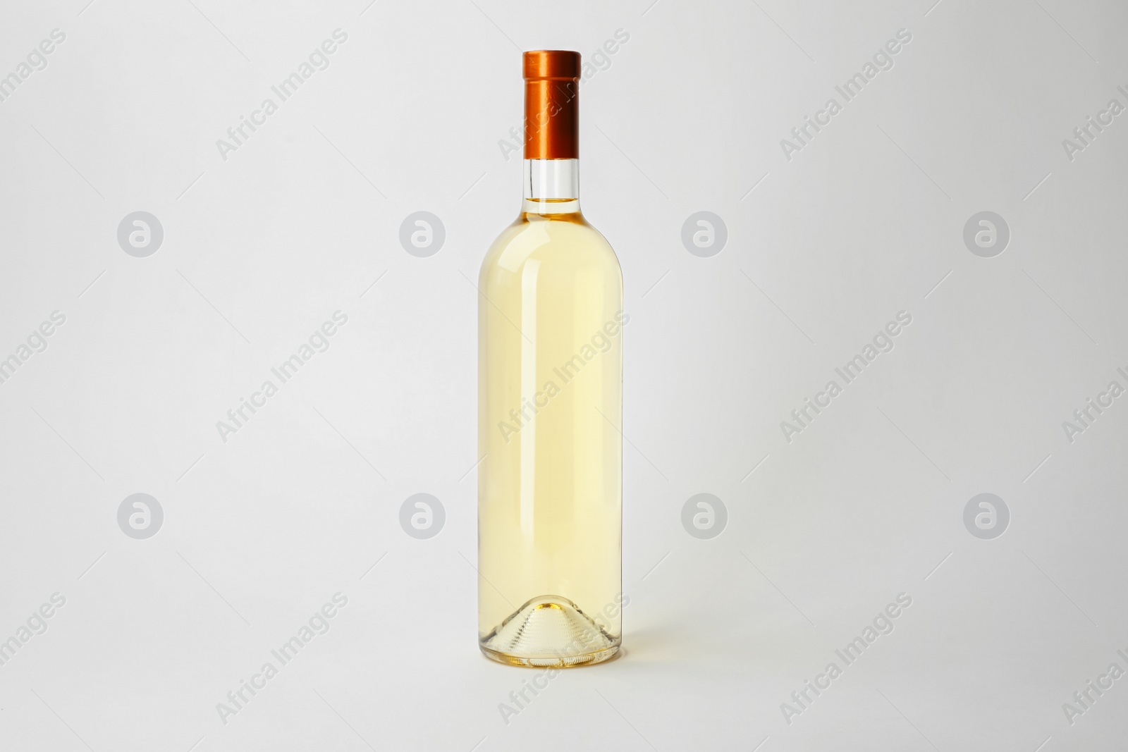 Photo of Bottle of expensive wine on white background