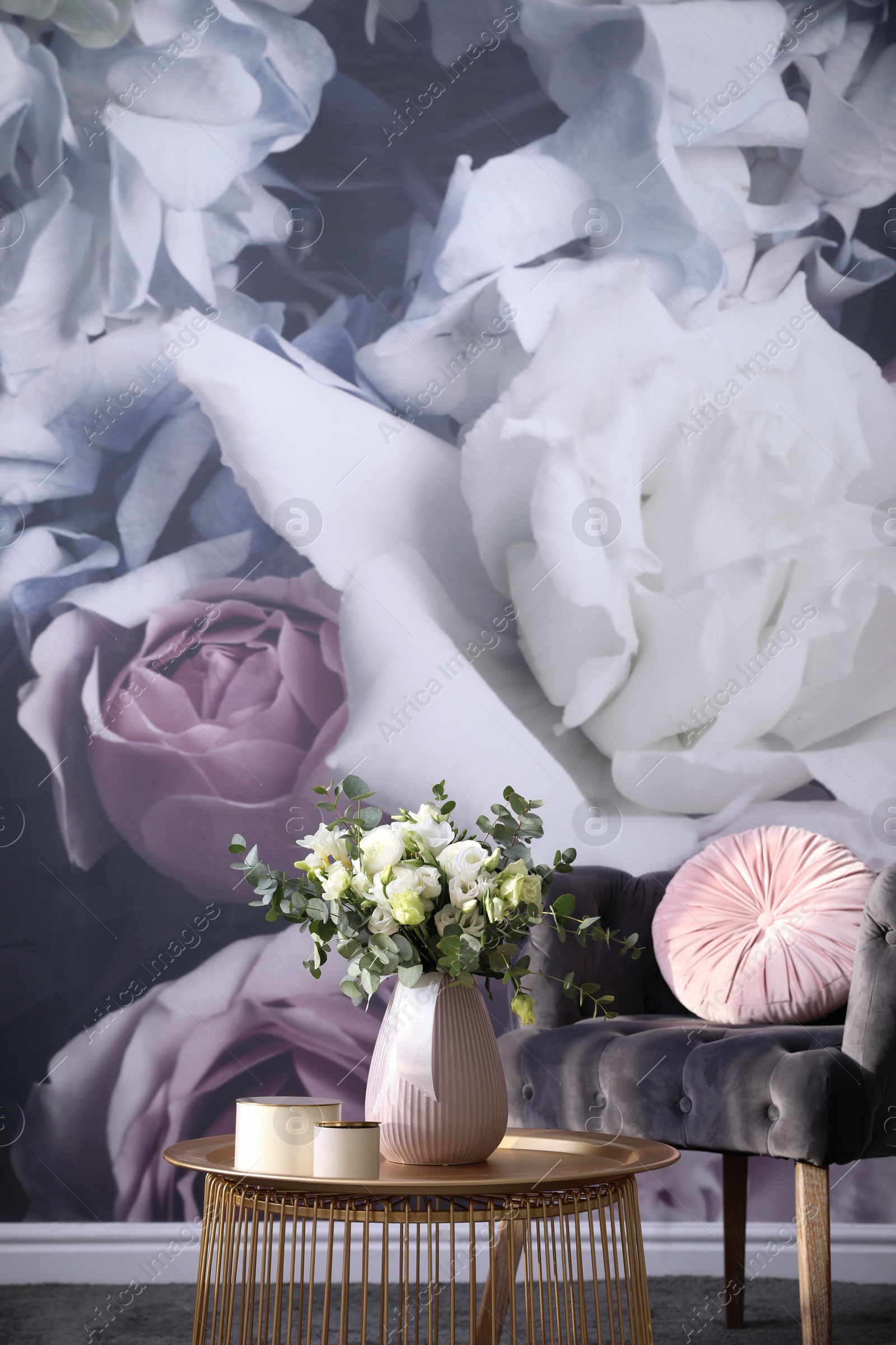 Photo of Beautiful bouquet of flowers on table in room. Stylish interior design