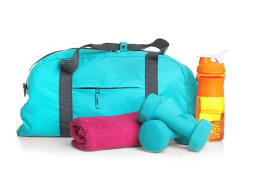 Sports bag and gym stuff on white background