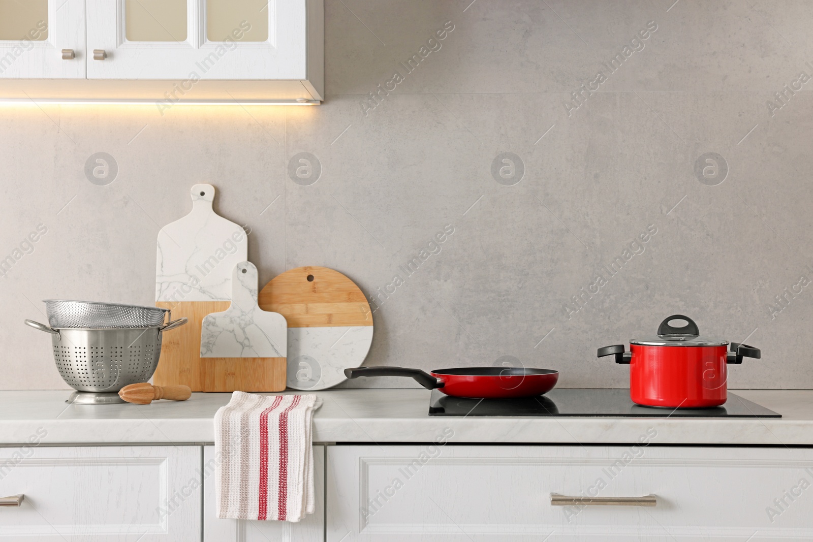 Photo of Set of different utensils on countertop in kitchen