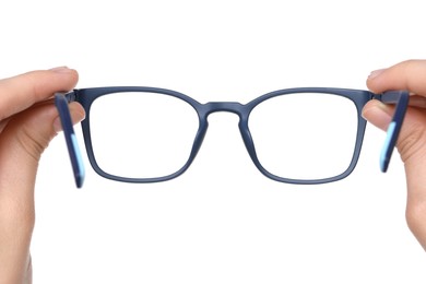 Photo of Woman holding stylish glasses with blue frame on white background, closeup