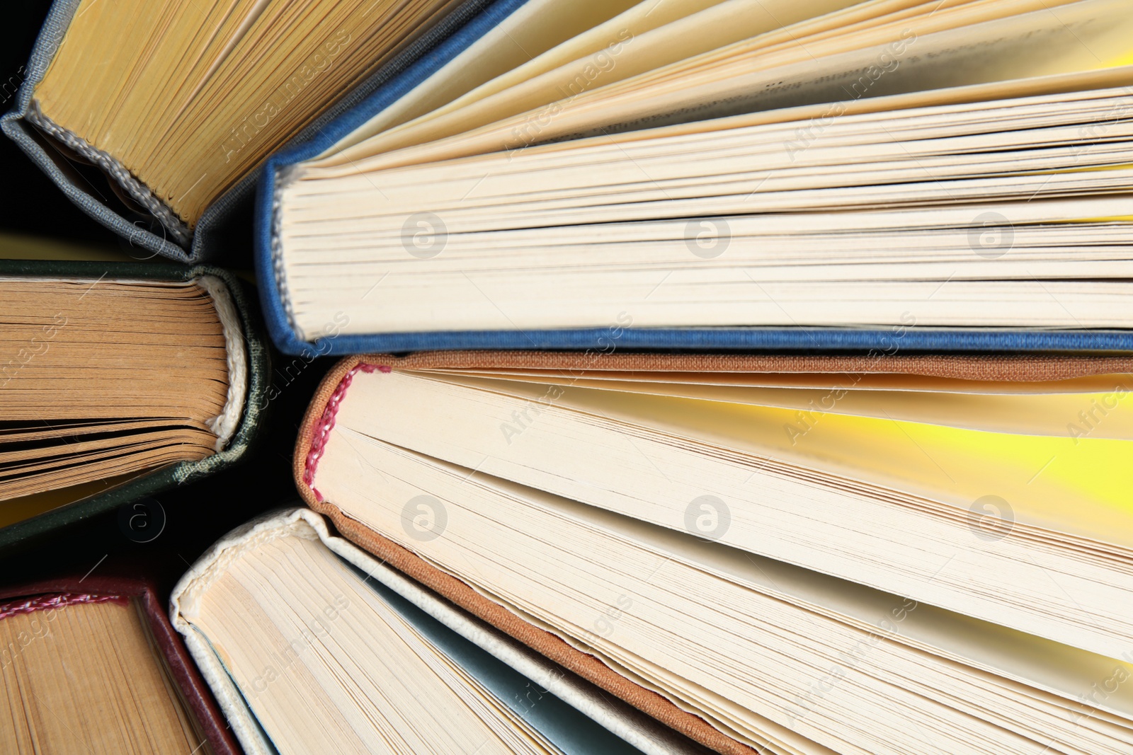 Photo of Hardcover old books as background, top view