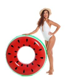 Beautiful young woman with inflatable ring on white background