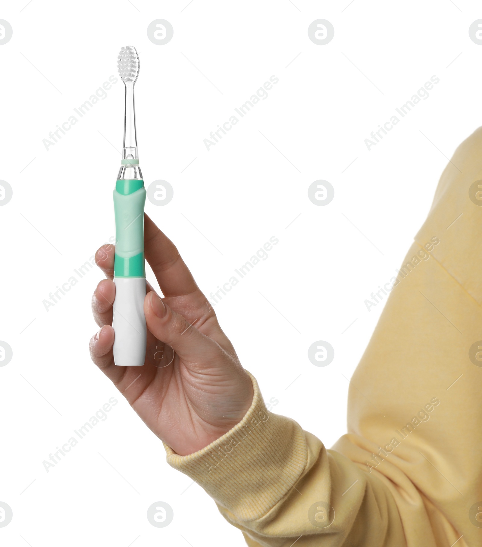 Photo of Woman holding electric toothbrush on white background, closeup