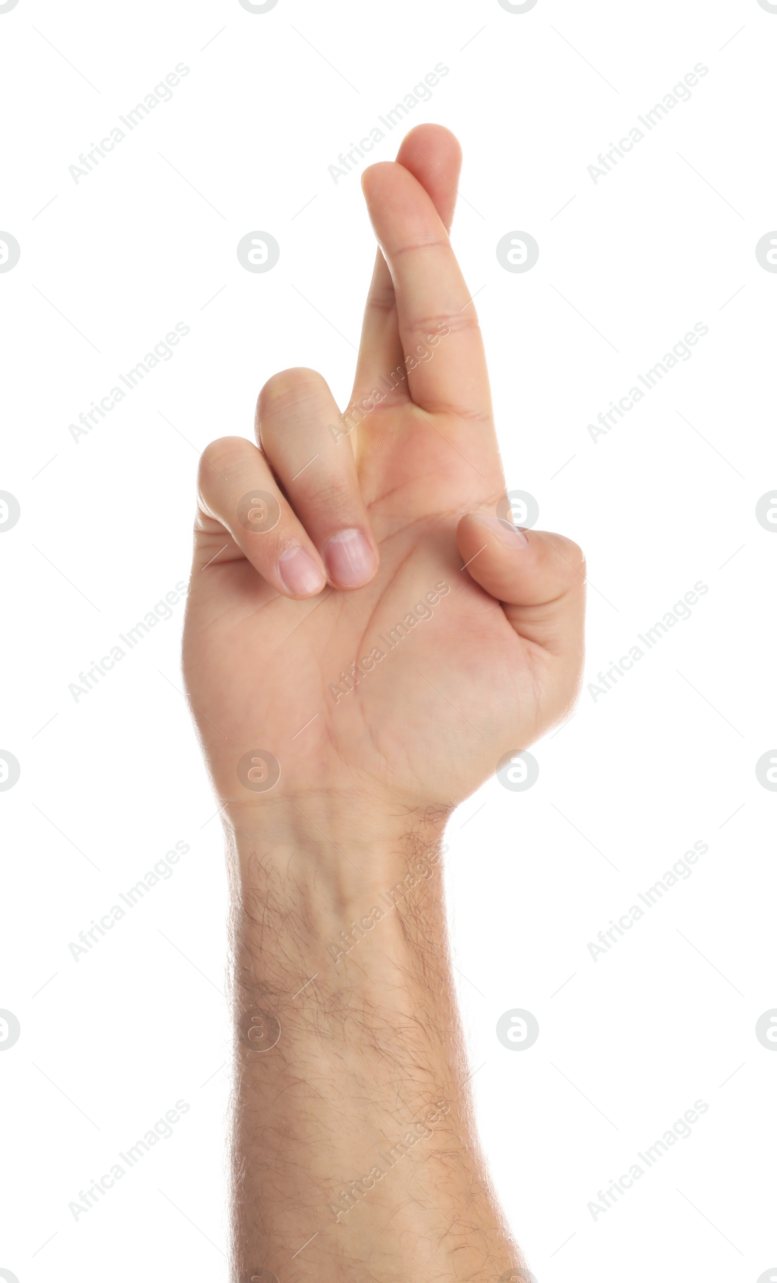 Photo of Man with crossed fingers on white background, closeup. Superstition concept