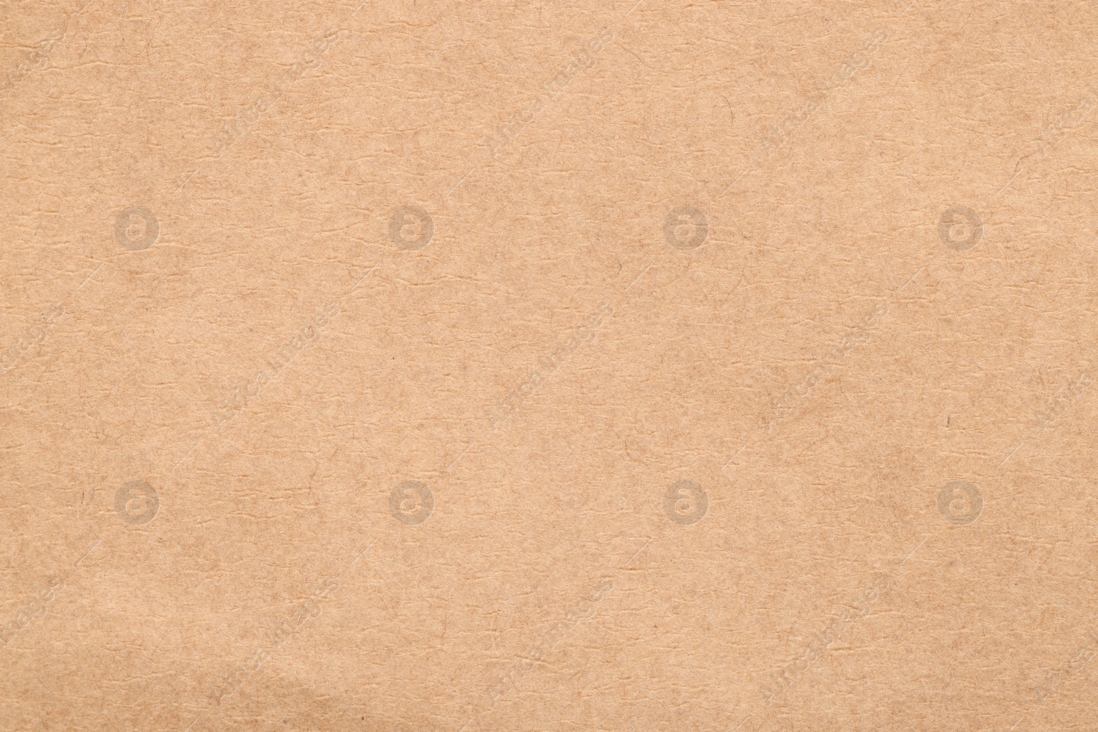 Photo of Texture of beige paper sheet as background, top view