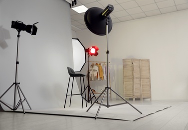 Photo of Interior of modern photo studio with professional equipment