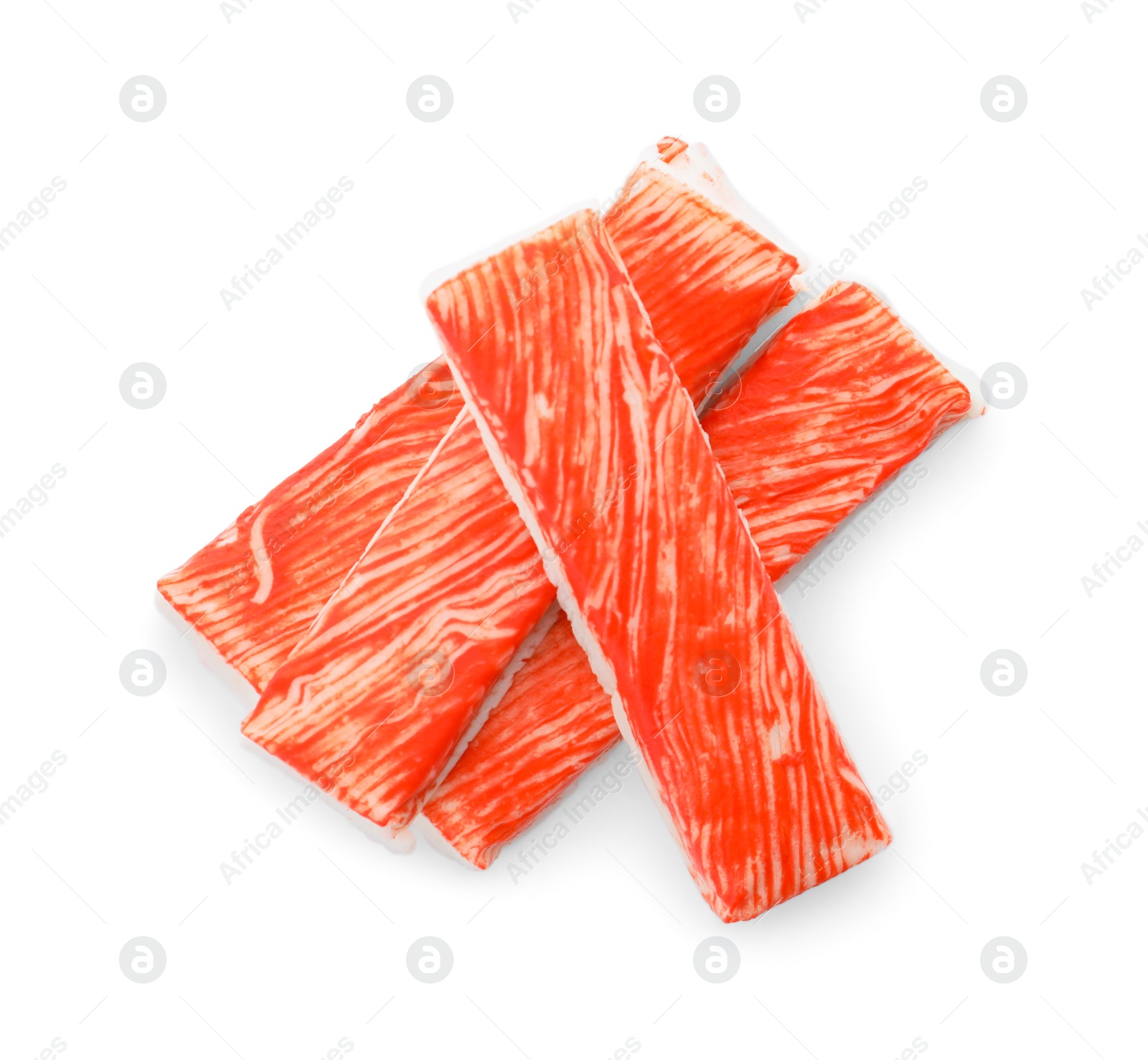 Photo of Delicious fresh crab sticks isolated on white, top view