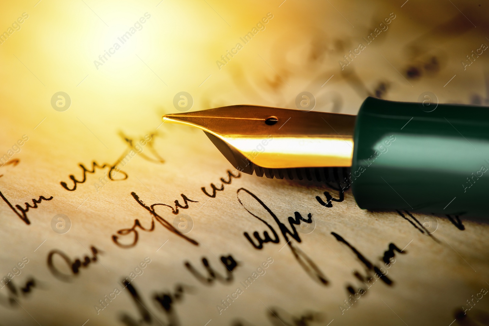 Image of Fountain pen on handwritten letter, closeup view