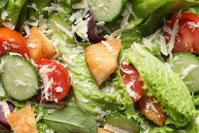 Photo of Delicious salad with chicken, cheese and vegetables as background, top view