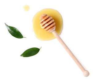 Wooden dipper with fresh honey and green leaves on white background, top view