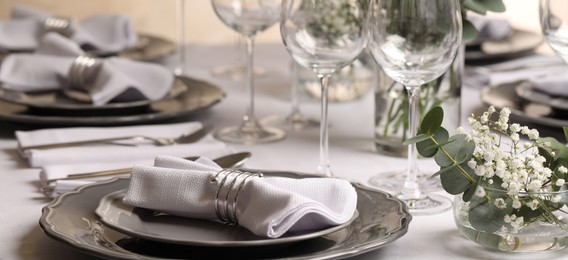 Stylish elegant table setting for festive dinner in restaurant. Banner design