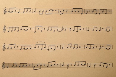 Photo of Paper sheet with musical notes, closeup view